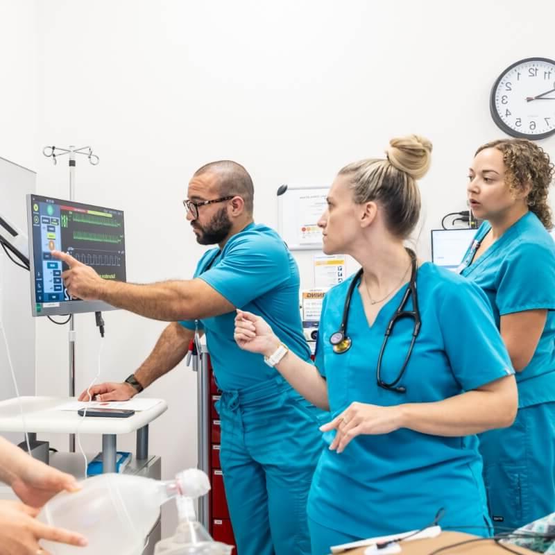 Medical professionals discussing in a healthcare environment.